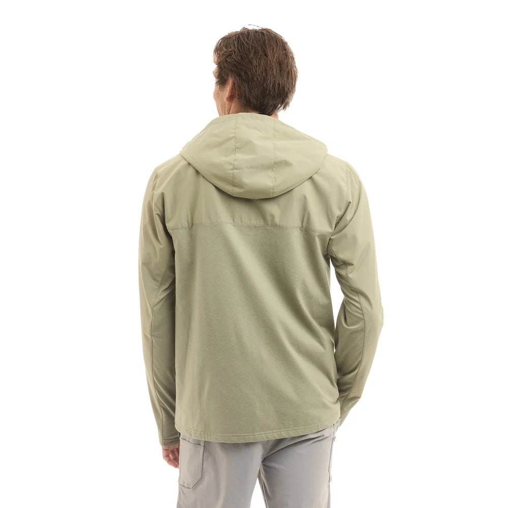 A man viewed from behind wearing a light sage green hooded jacket and light gray pants, set against a plain white background.
