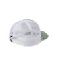 A white trucker-style cap with a white mesh back and a curved brim featuring a green and beige striped pattern, shown from a three-quarters angle on a white background.