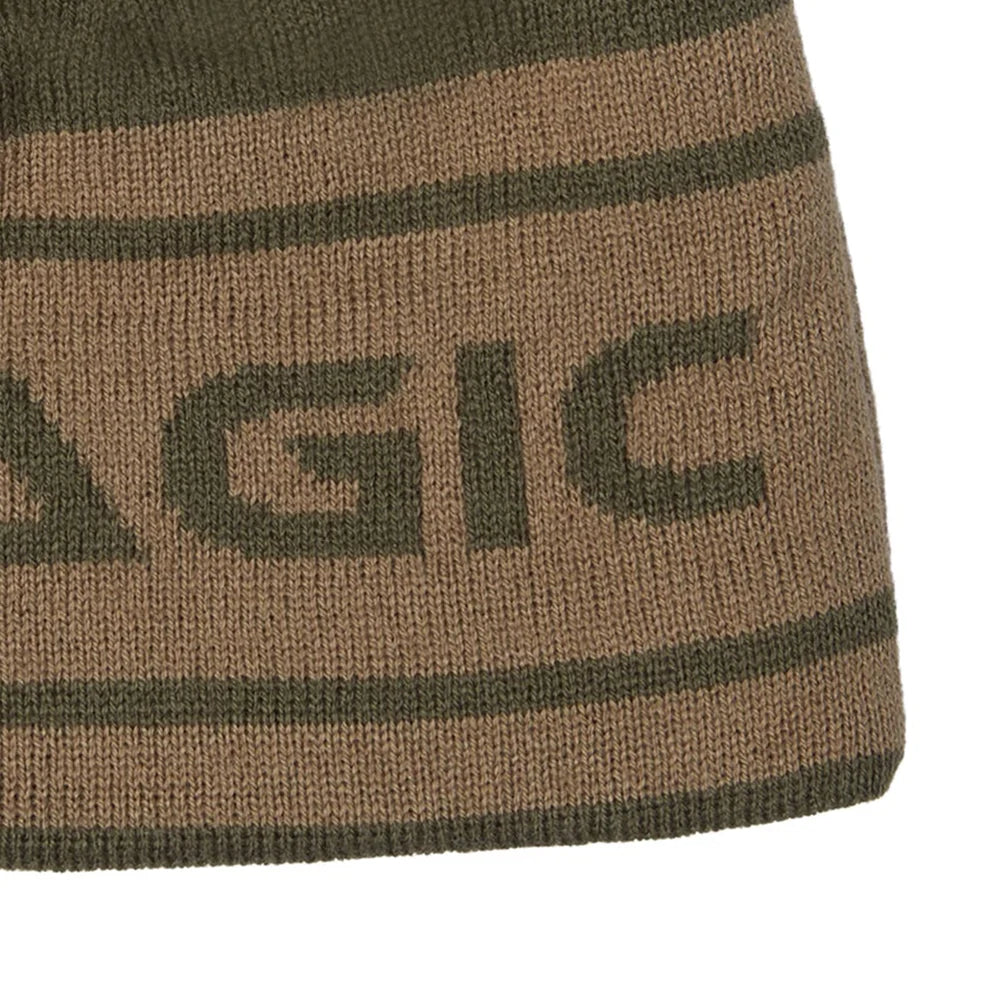 Close-up of a ribbed knit beanie in brown and dark olive green, featuring the partial word 'AGIC' in dark green knit lettering.