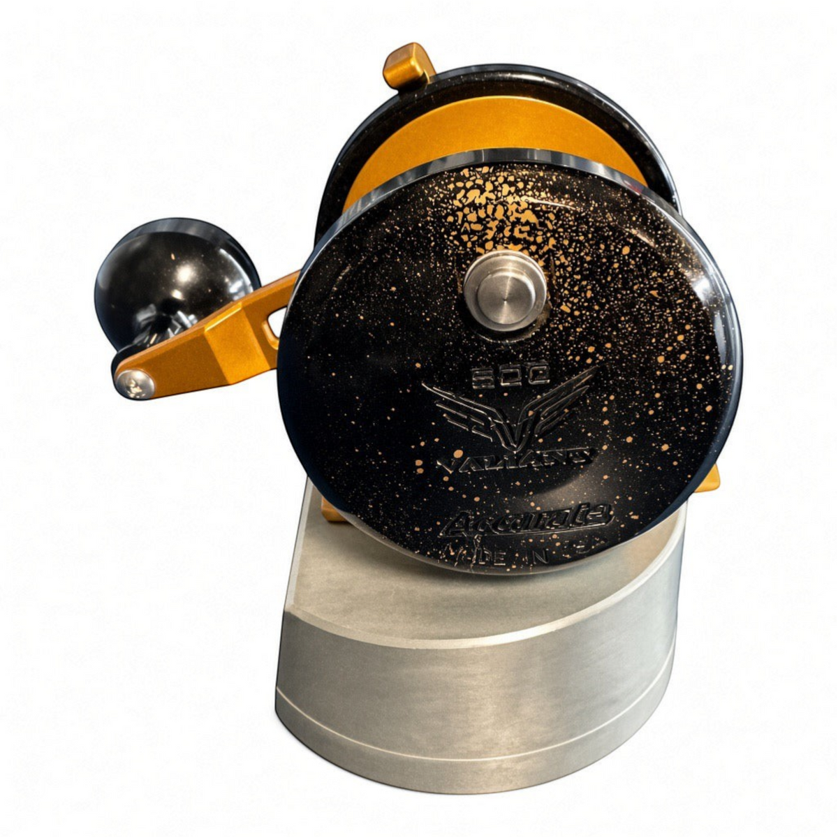 Dogfish Tackle & Marine Accurate Valiant 2 conventional fishing reel in black and gold flake finish on a display stand.