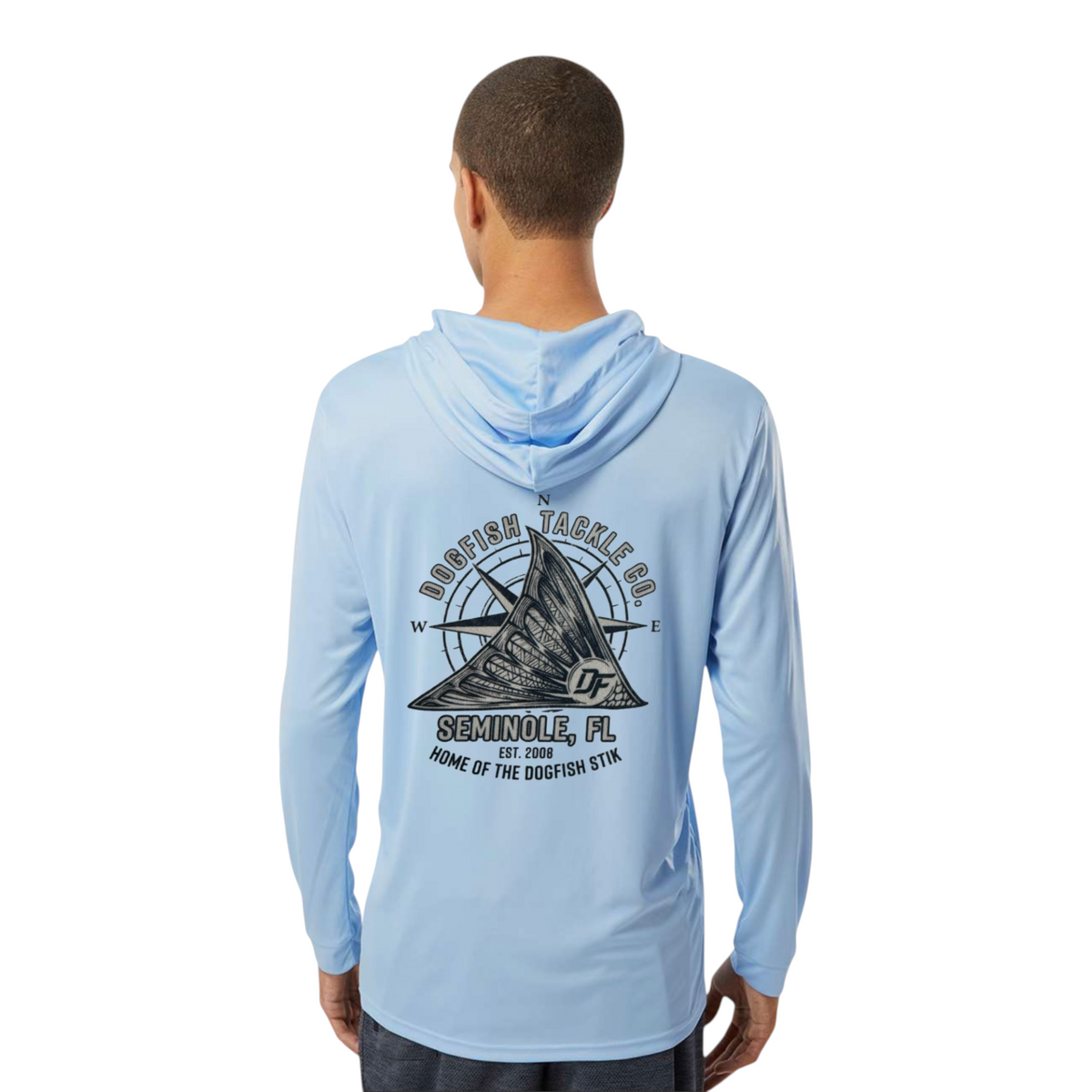 A man wearing a light blue Dogfish Tackle & Marine long sleeve performance hoodie with a tailing redfish logo on back.