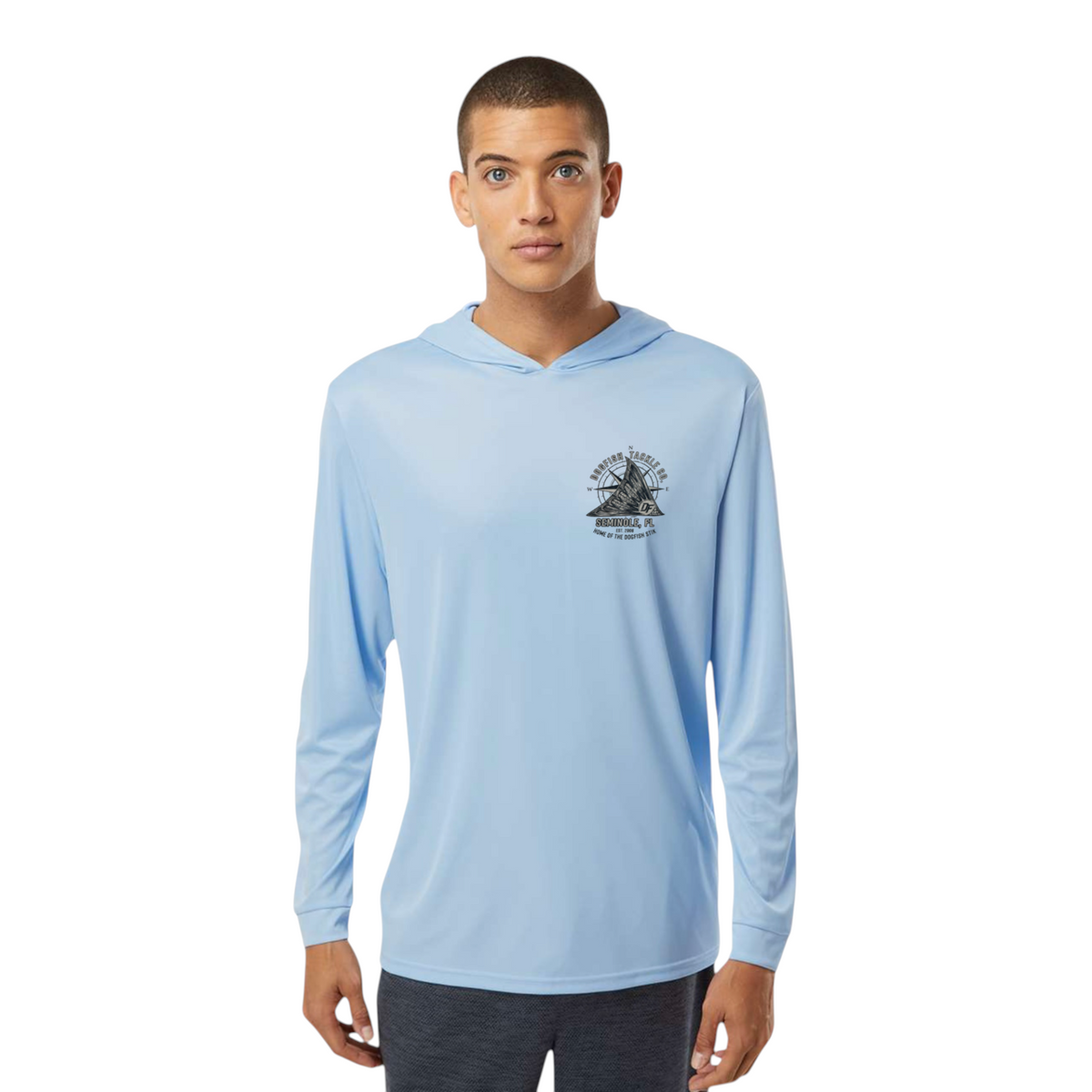 Dogfish Tackle & Marine light blue long sleeve performance hoodie with a black logo on the chest worn by a man