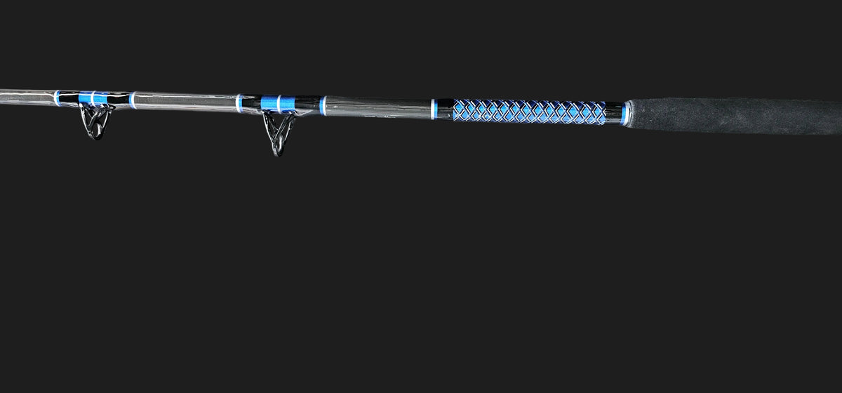 Up close picture of Dogfish Stik custom shark rod. showing a perfectly wrapped blue, silver and black butt wrap. you can also see Heavy Duty American Tackle Boat Guides 