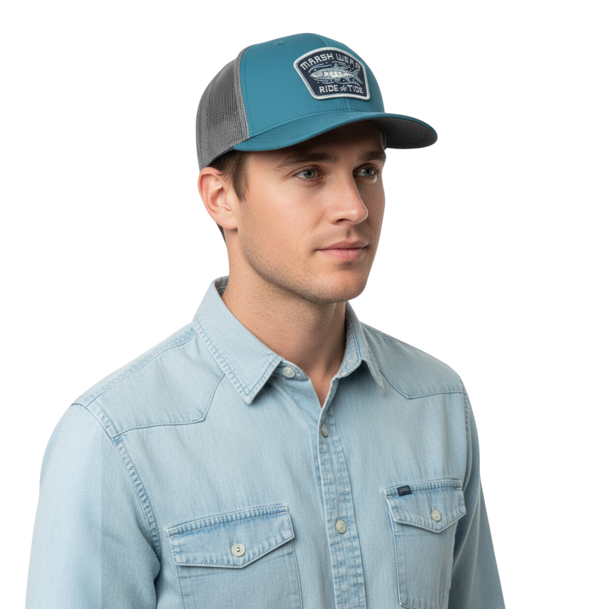 Dogfish Tackle & Marine Marsh Wear Currents trucker hat in teal and grey with a fishing graphic patch on a man