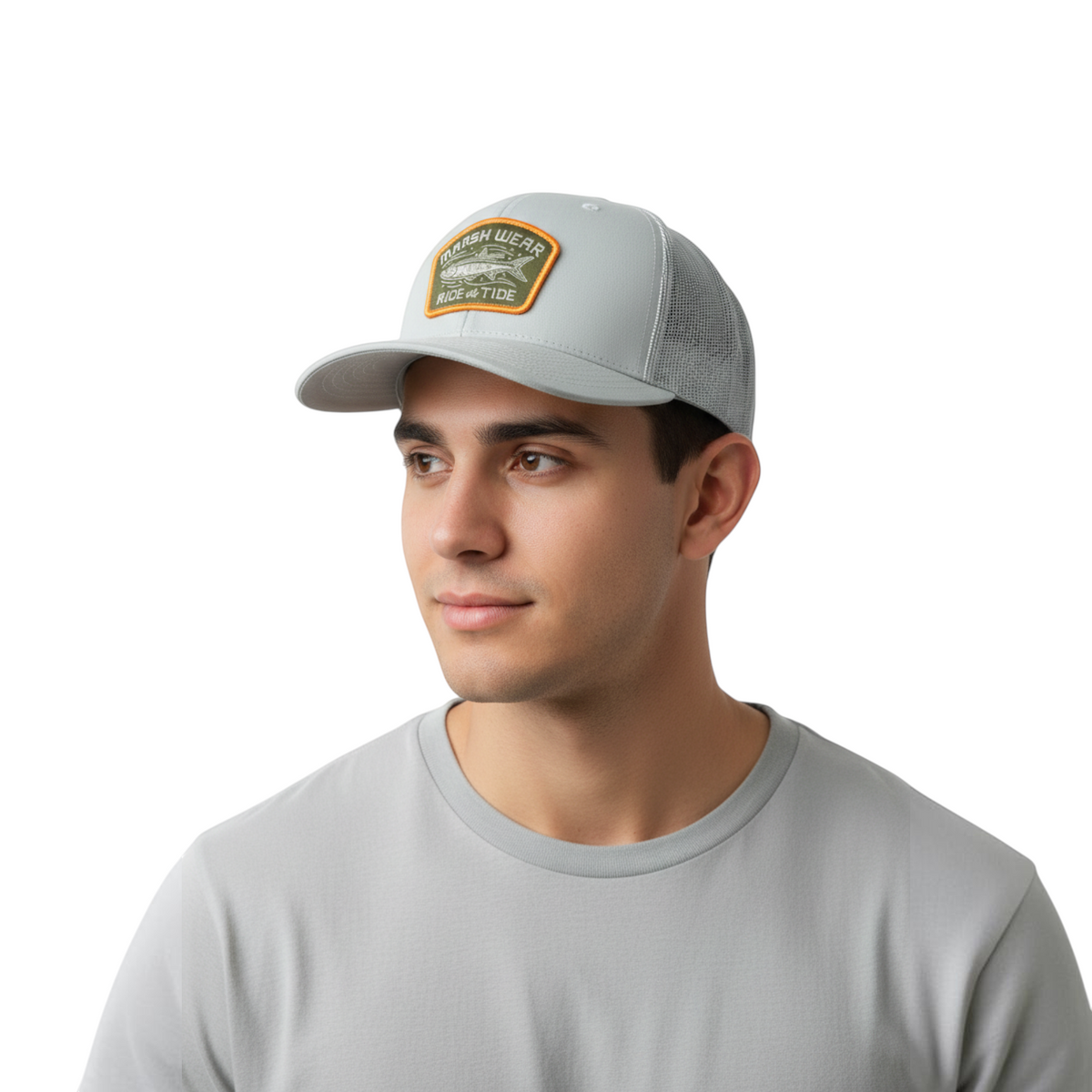 Dogfish Tackle & Marine Marsh Wear Currents grey 6-panel structured trucker hat with a fishing patch on a man