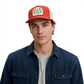 Dogfish Tackle & Marine Marsh Wear red and white cotton canvas trucker hat with woven patch on a male model