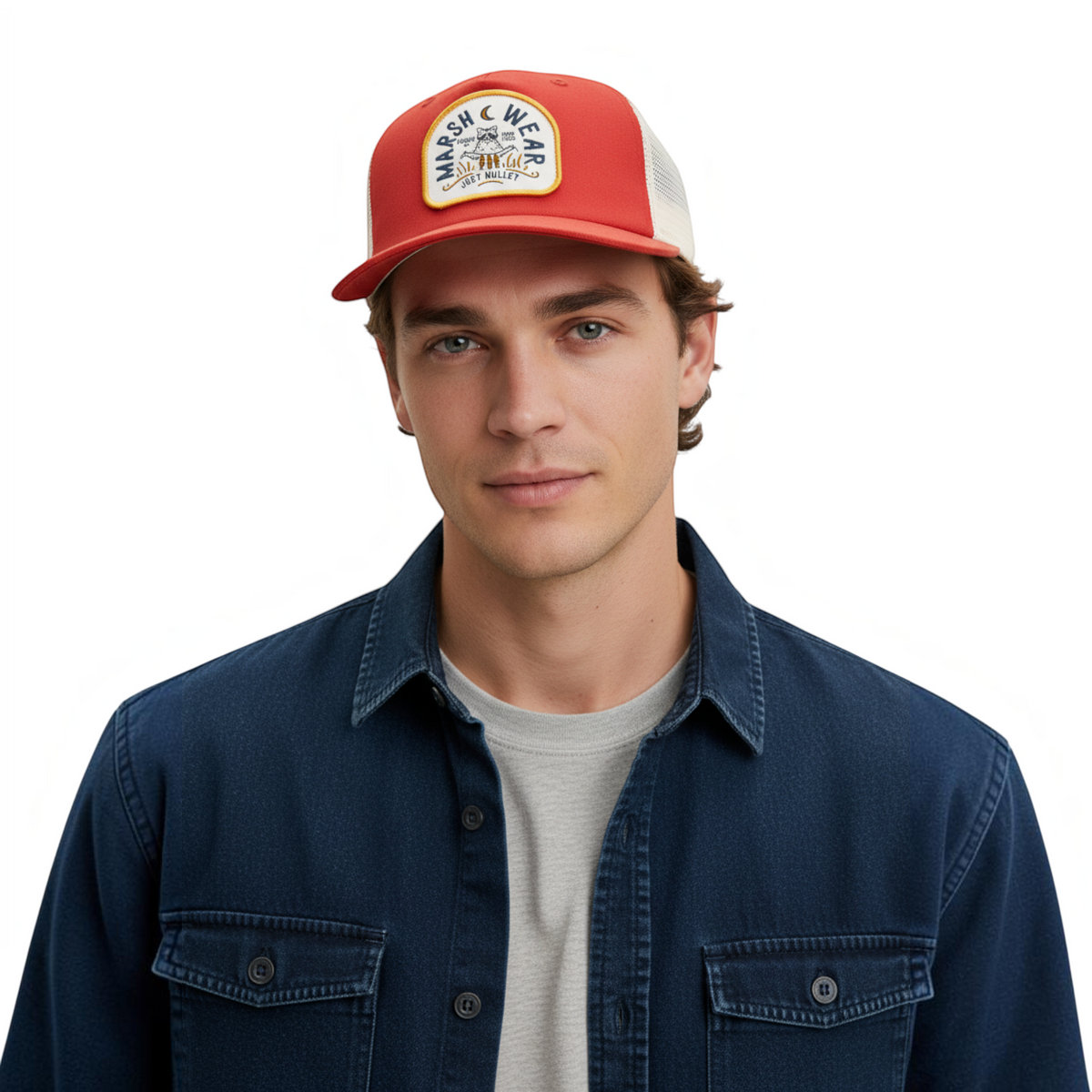 Dogfish Tackle & Marine Marsh Wear red and white cotton canvas trucker hat with woven patch on a male model