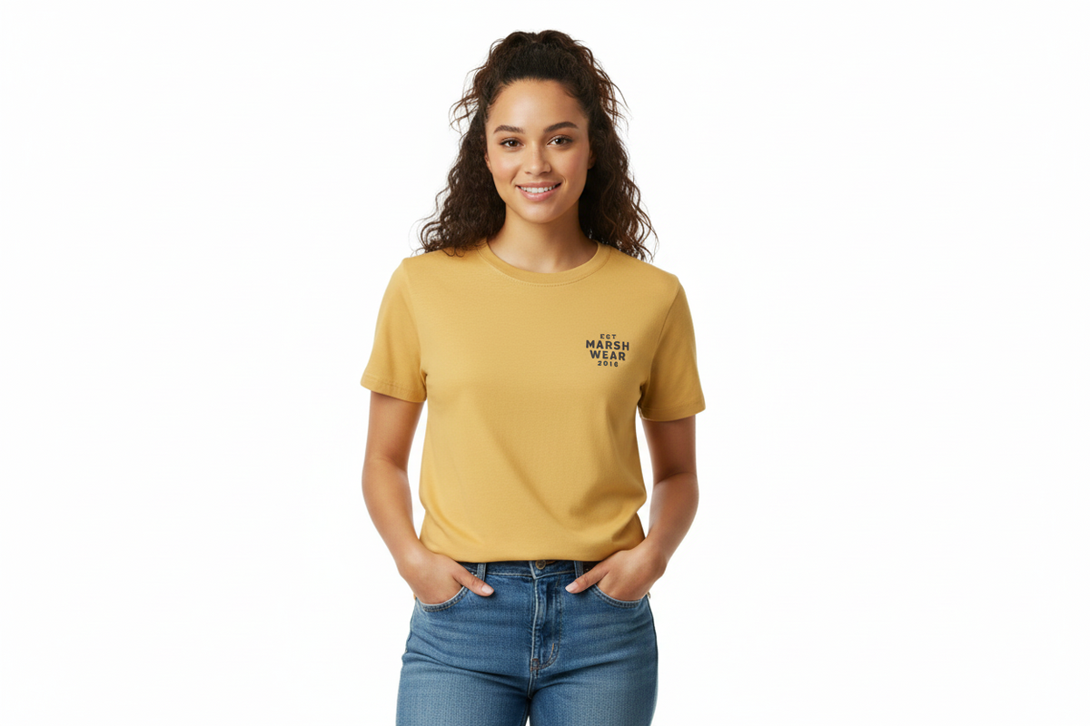 Dogfish Tackle & Marine model wearing a mustard yellow Marsh Wear cotton crew neck t-shirt with chest logo