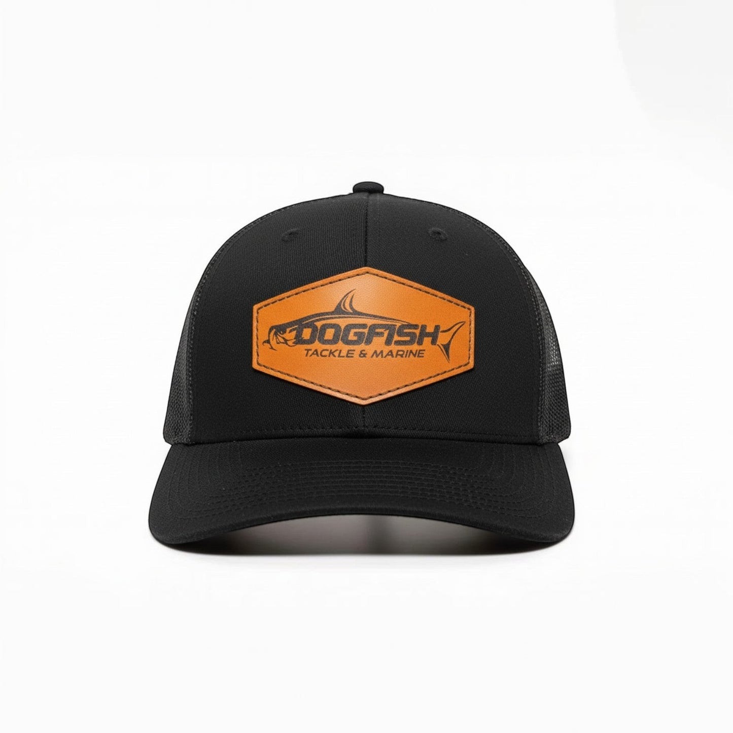 Dogfish Tackle & Marine black trucker hat with a hexagonal leather patch featuring a tarpon logo.