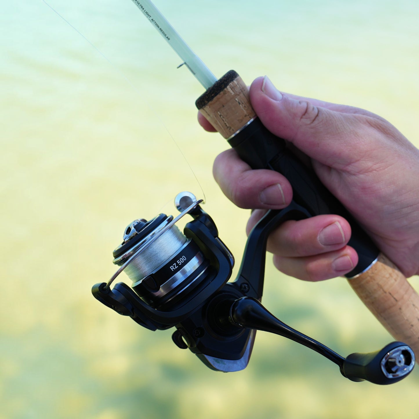 Dogfish Tackle & Marine Daiwa RZ500 ultralight spinning reel attached to a cork handle fishing rod