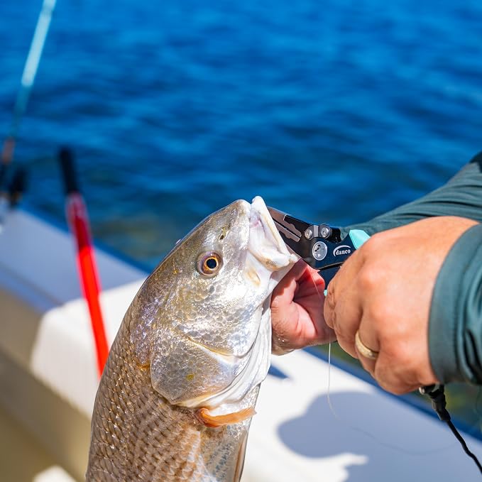 Dogfish Tackle & Marine Danco Pro Series aluminum fishing pliers removing a hook from a redfish on a boat