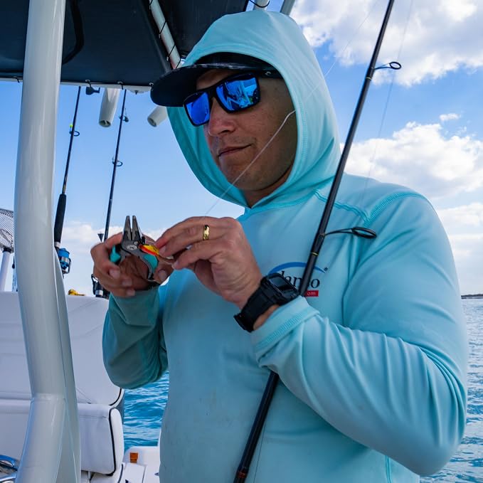 Dogfish Tackle & Marine angler using Danco Pro Series aluminum pliers to rig a fishing lure on a boat deck