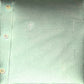 Dogfish Tackle & Marine light green button-down shirt with a subtle wave pattern and embroidered fish logo on chest pocket.