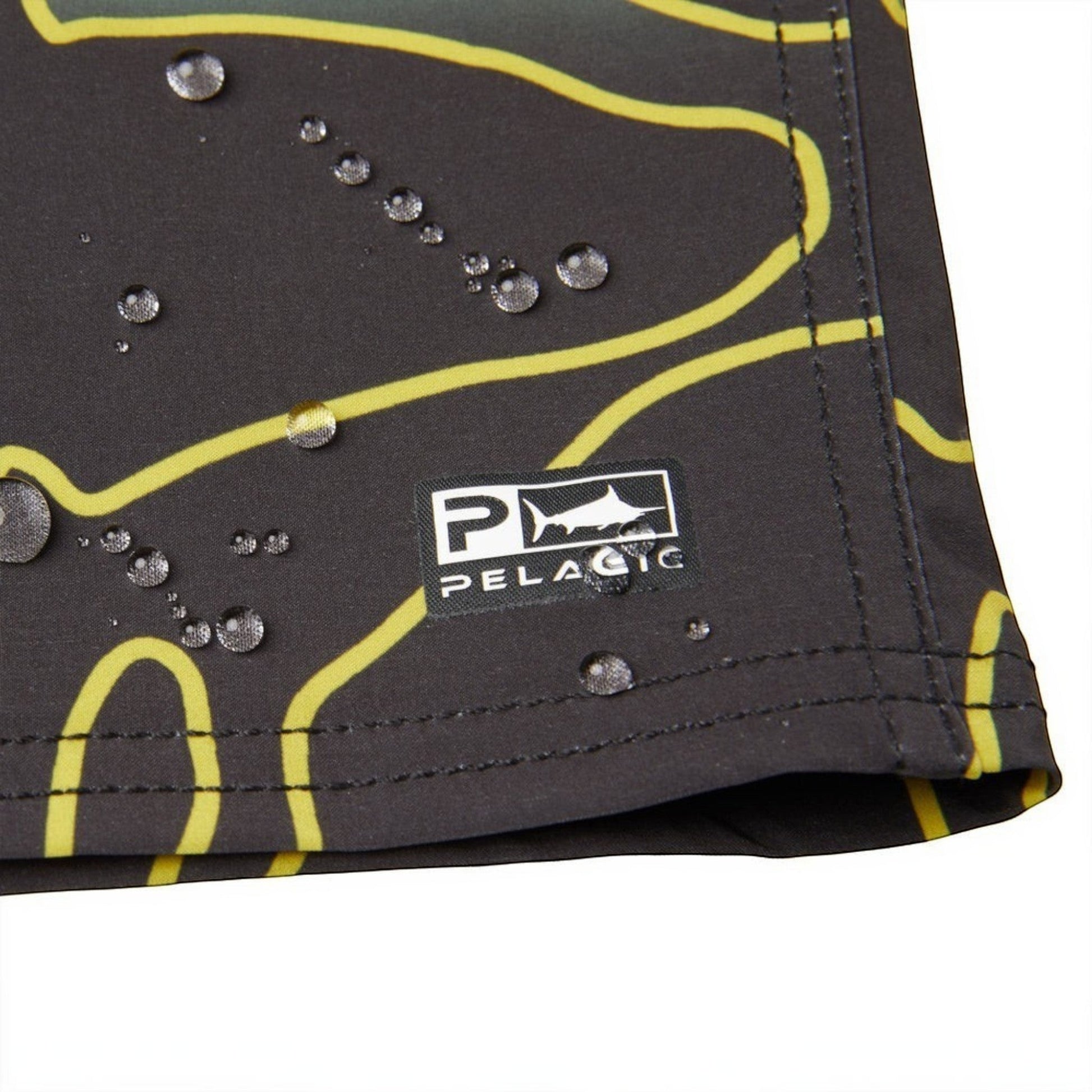 Dogfish Tackle & Marine black boardshorts with yellow abstract lines and water droplets. Features Pelagic logo.