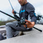 Dogfish Tackle & Marine Shimano Curado DC baitcasting reel in gunmetal grey with black handle, held by a person on a boat.