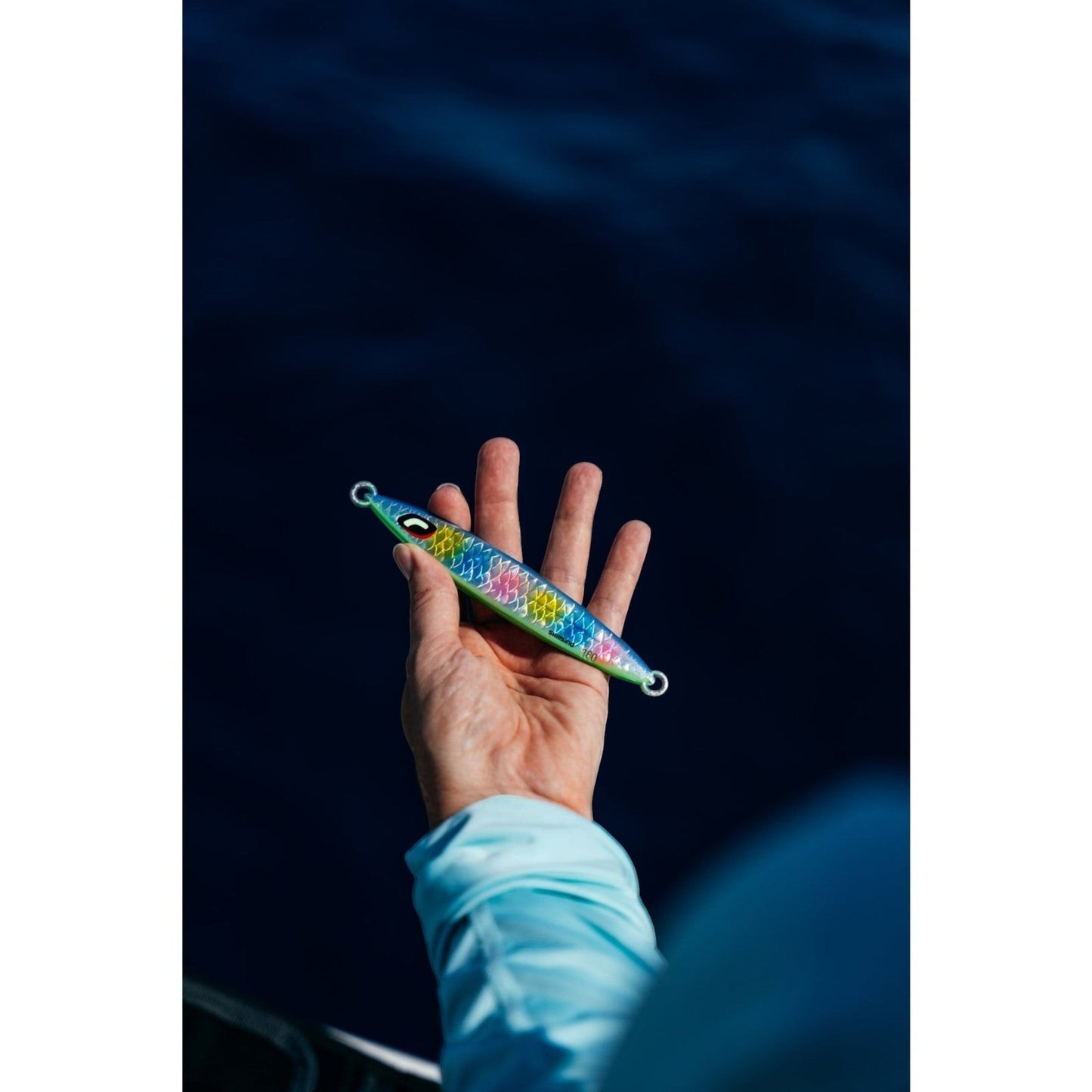 Dogfish Tackle & Marine Shimano Ocea Sardine Waver 180g slow pitch jig with scale boost finish held in a hand