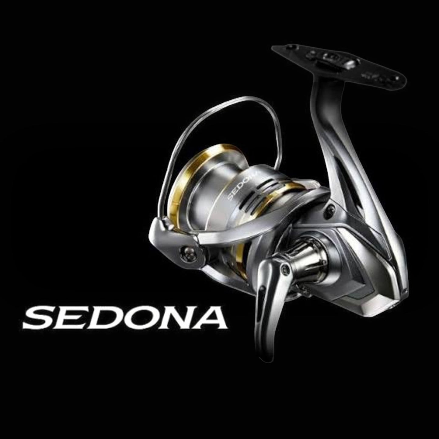 Dogfish Tackle & Marine Shimano Sedona FJ spinning reel in silver and gold, featuring HAGANE Gear and SilentDrive technology.