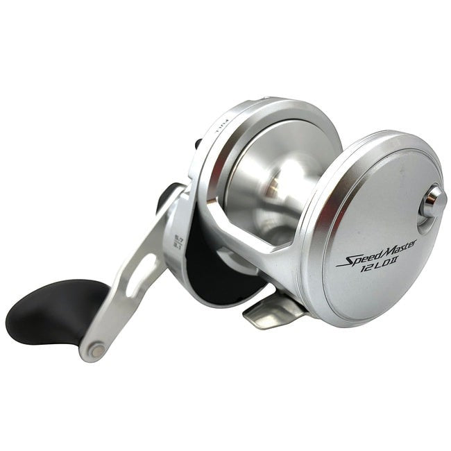 Dogfish Tackle & Marine silver Shimano Speedmaster 12II conventional fishing reel with black handle grip and gear ratio indicators.