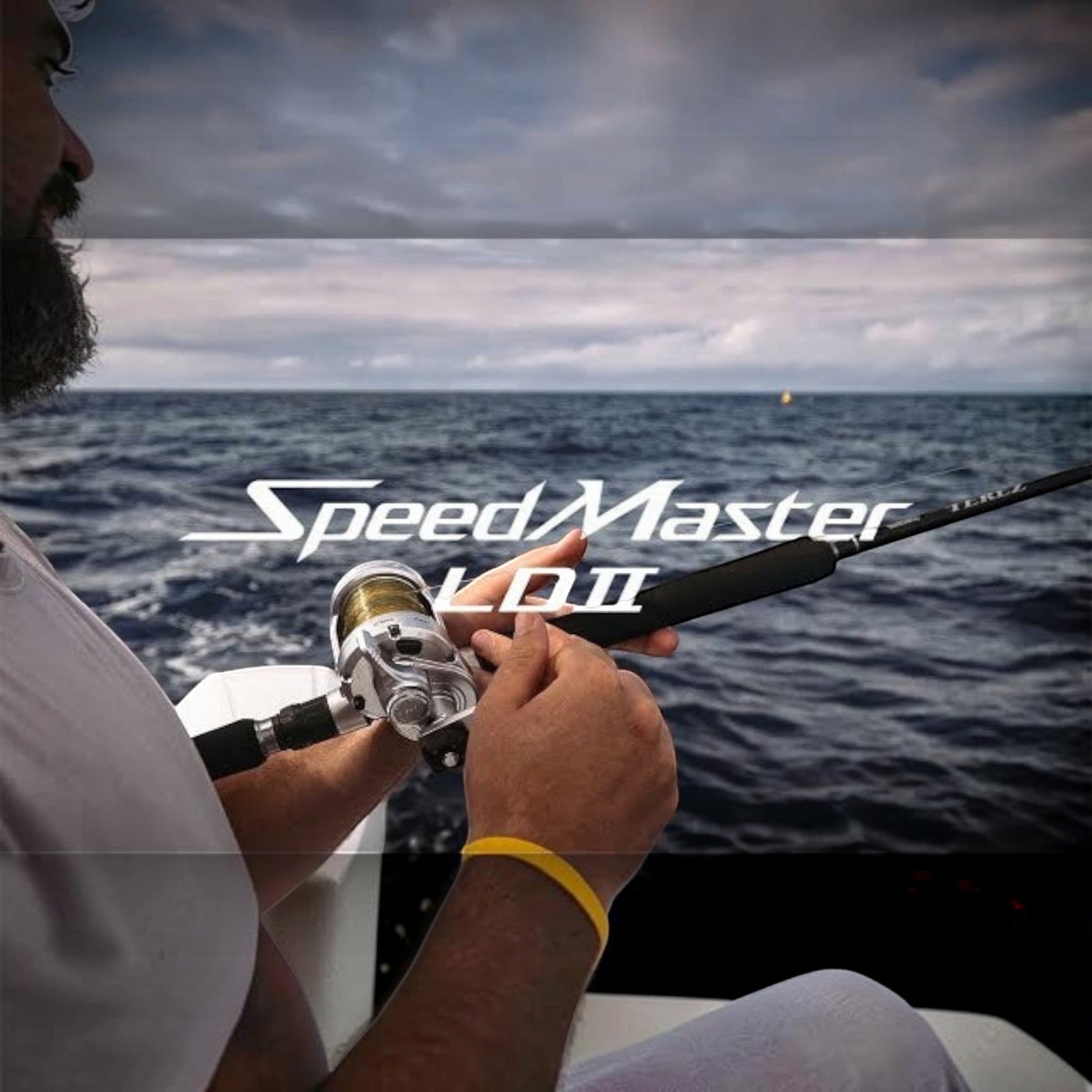 Dogfish Tackle & Marine Shimano SpeedMaster II conventional fishing reel, silver and gold, with black rod. Two-speed lever drag.