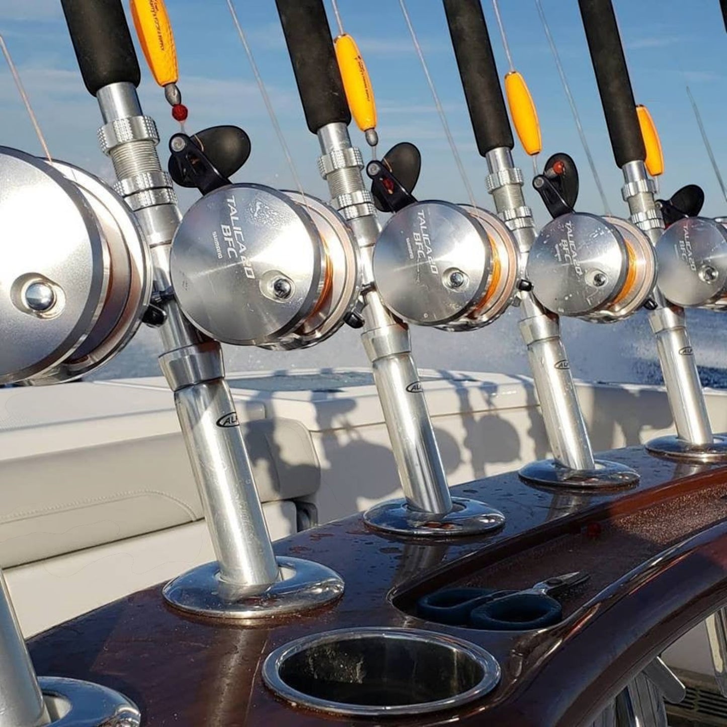 Dogfish Tackle & Marine Shimano Talica 20BFC silver lever drag fishing reels on a boat rod holders.