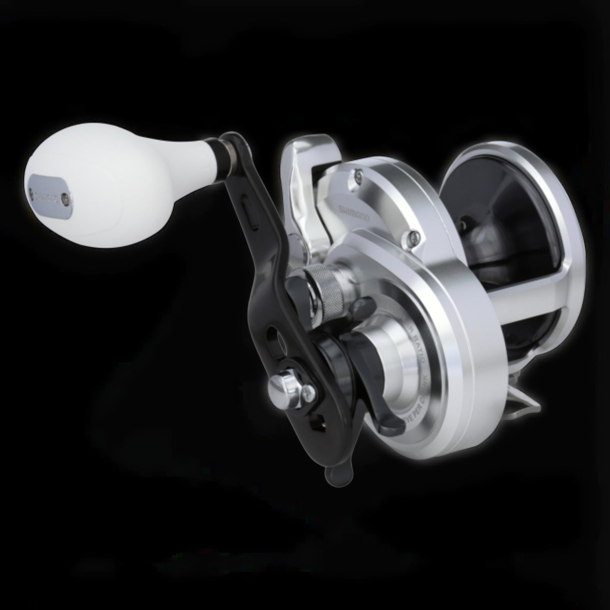 Dogfish Tackle & Marine Shimano Trinidad A conventional fishing reel, silver with a white handle knob and black accents. Features X-Ship and Hagane Body.