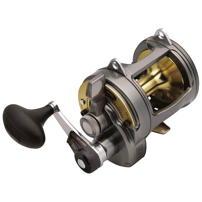 Dogfish Tackle & Marine Shimano Tyrnos 2-Speed fishing reel, gunmetal grey with gold spool, features two-speed gear ratio and lever drag.