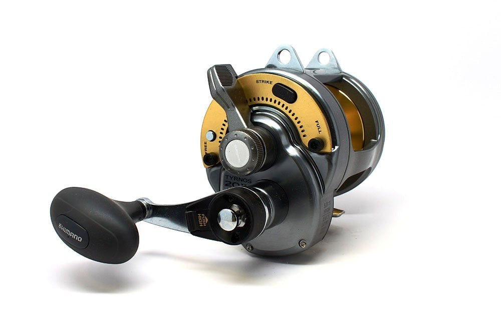 Dogfish Tackle & Marine Shimano Tyrnos 20II 2-Speed fishing reel, gunmetal grey with gold accents, lever drag, and ergonomic handle.