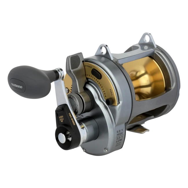 Dogfish Tackle & Marine Shimano Tyrnos 2-Speed fishing reel, silver and gold with a grey handle. Features 2-speed gear ratio.