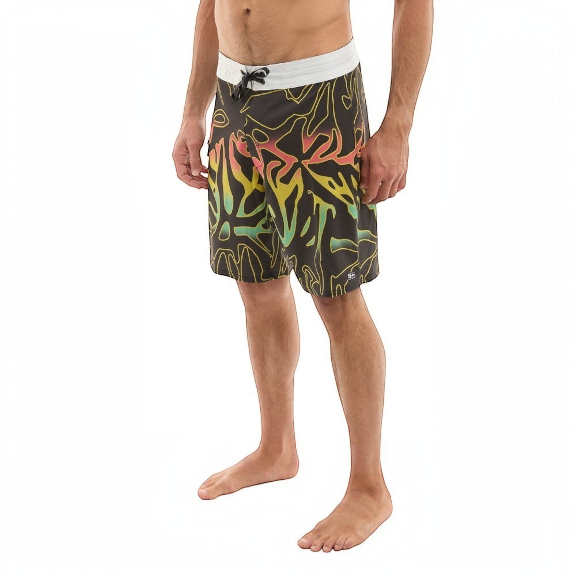 Dogfish Tackle & Marine black boardshorts with abstract yellow, green, and pink design. Features a white waistband and drawstring.
