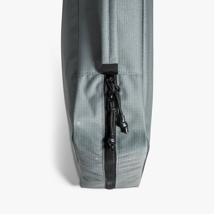 Dogfish Tackle & Marine grey water-resistant utility gear bag with black zipper and pull tabs.