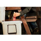 Dogfish Tackle & Marine white Yeti Tundra 50 hard cooler with a person reaching for a drink at a wooden table
