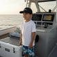Dogfish Tackle & Marine youth black mesh back hat with logo, worn by a boy on a boat.
